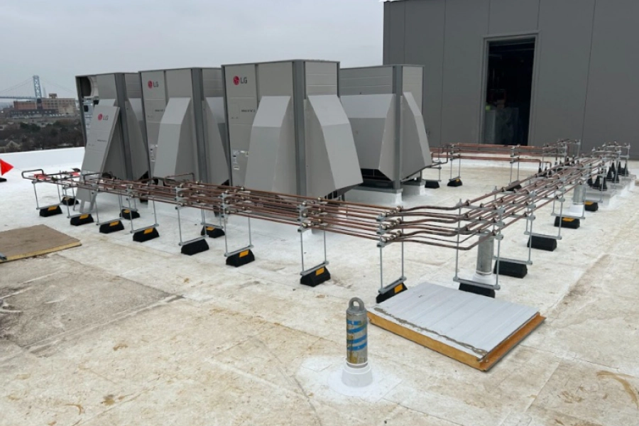 commercial hvac devices with a wire structure around on top of a roofing